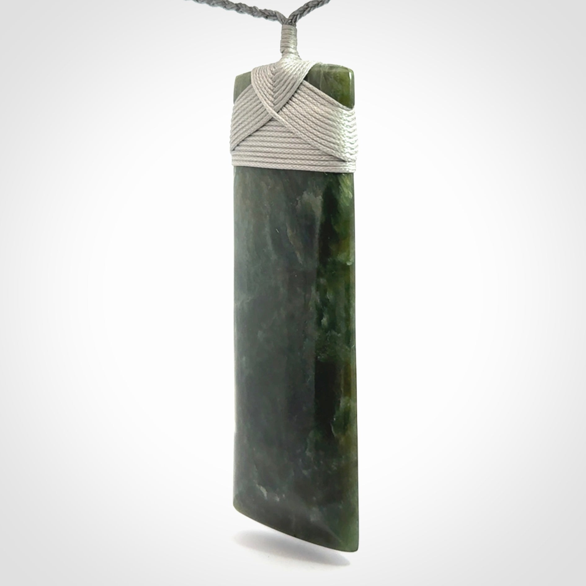 Hand carved large New Zealand Jade toki pendant.