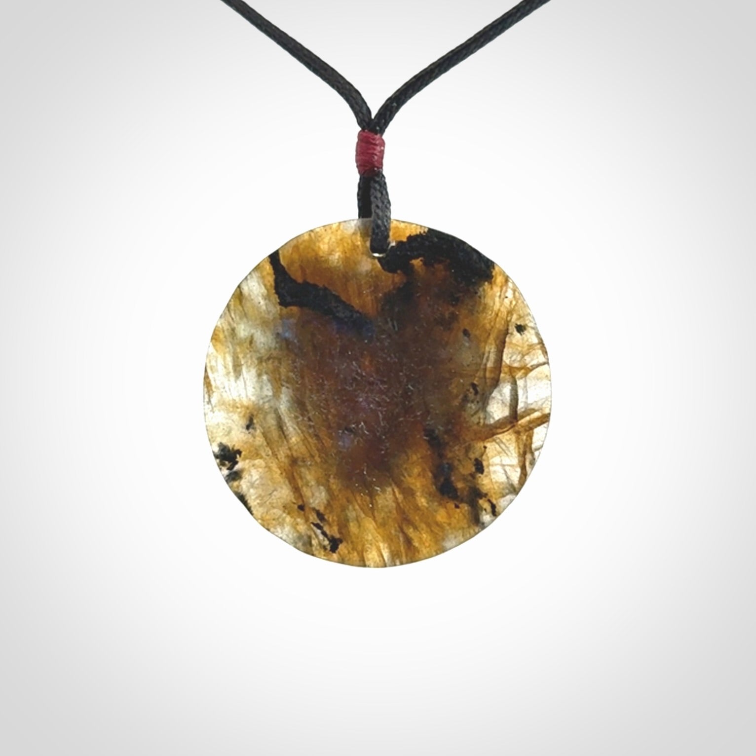 This is a hand carved wolf pendant made from Labradorite stone.