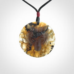 This is a hand carved wolf pendant made from Labradorite stone.