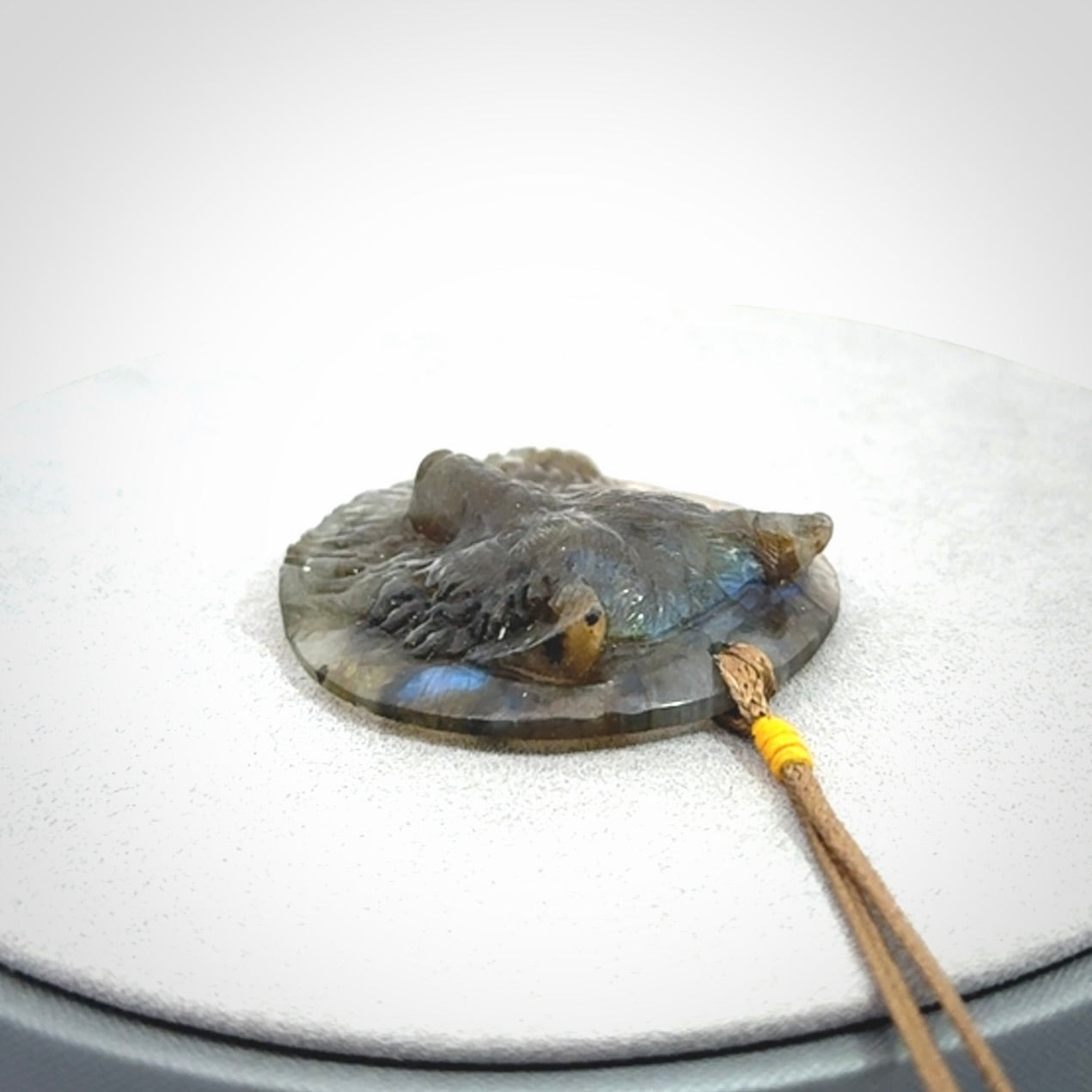 This is a hand carved wolf pendant made from Labradorite stone.