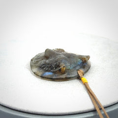 This is a hand carved wolf pendant made from Labradorite stone.