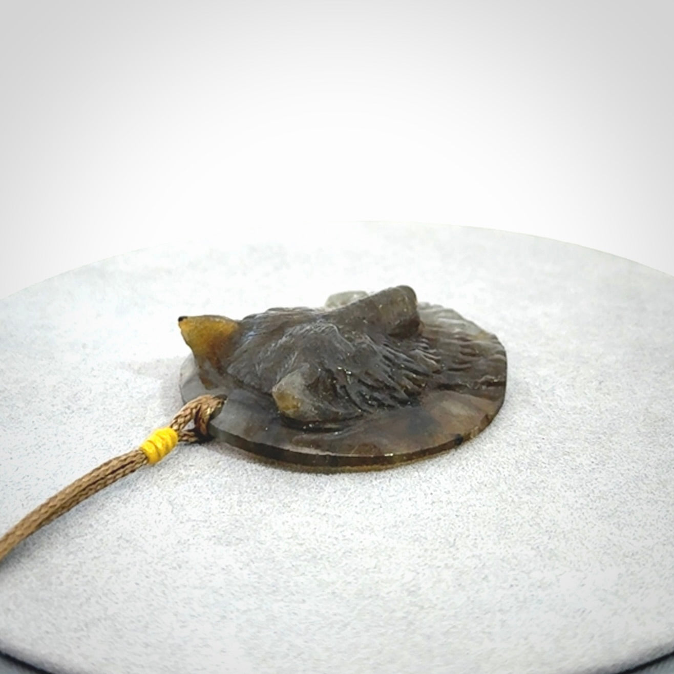 This is a hand carved wolf pendant made from Labradorite stone.