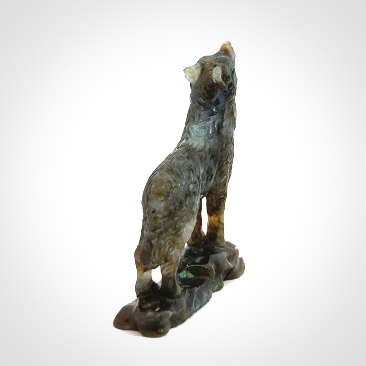 This is a hand carved wolf sculpture made from Labradorite stone.