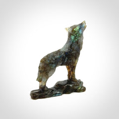 This is a hand carved wolf sculpture made from Labradorite stone.