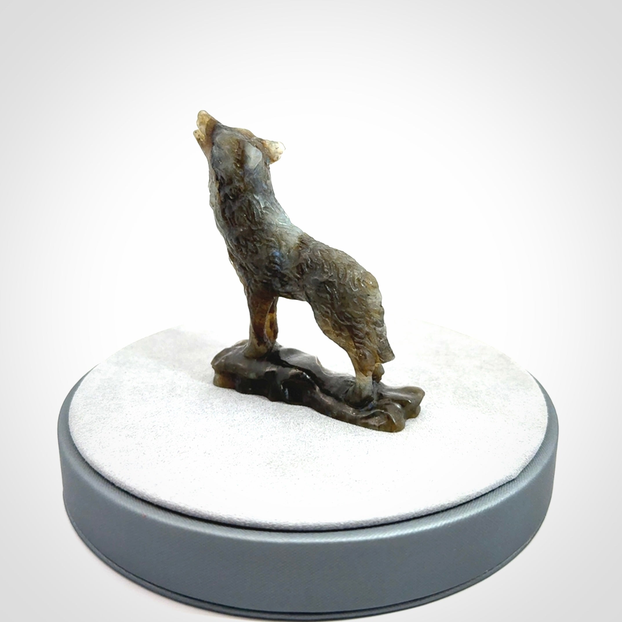 This is a hand carved wolf sculpture made from Labradorite stone.