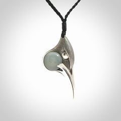 This is a hand carved Sterling Silver Huia bird pendant with Siberian Jade insert. This is a medium sized necklace and is provided with an adjustable black cord.