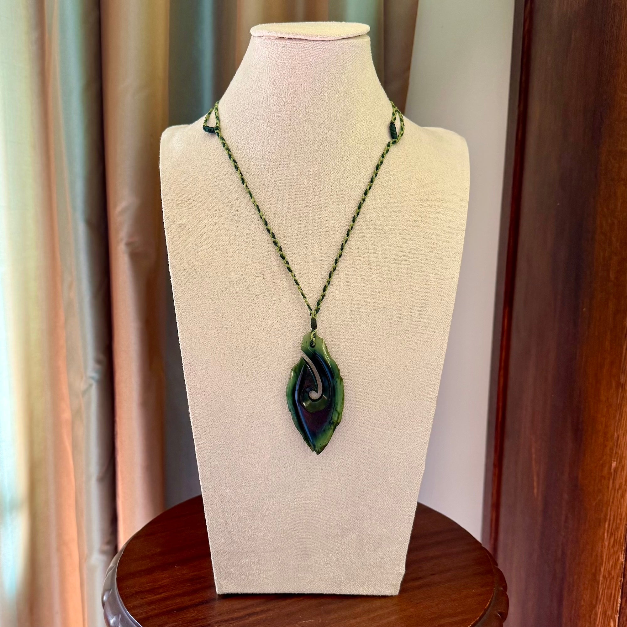 Hand carved New Zealand jade hook, matau pendant.