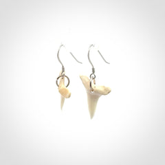 Hand carved small sized mako shark tooth earrings. Hand made shark tooth earrings. Real shark tooth art to wear. Free Shipping worldwide. Packaged in a woven kete pouch.
