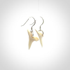 Hand carved small sized mako shark tooth earrings. Hand made shark tooth earrings. Real shark tooth art to wear. Free Shipping worldwide. Packaged in a woven kete pouch.