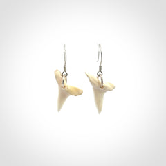 Hand carved small sized mako shark tooth earrings. Hand made shark tooth earrings. Real shark tooth art to wear. Free Shipping worldwide. Packaged in a woven kete pouch.