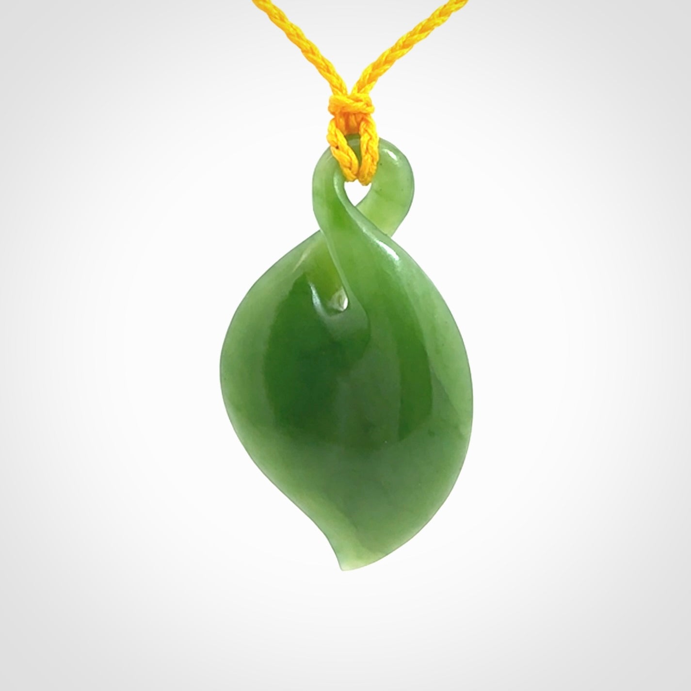 Hand carved New Zealand jade, single twist pendant with adjustable cord.