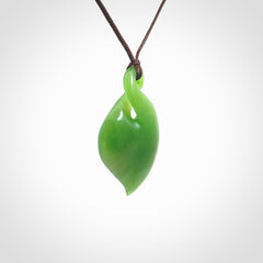 Hand carved New Zealand jade, single twist pendant. Maori pikorua pendant hand carved in New Zealand. Made by NZ Pacific, jade jewellery for sale online. One only hand made by Ross Crump.