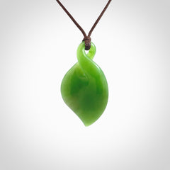 Hand carved New Zealand jade, single twist pendant. Maori pikorua pendant hand carved in New Zealand. Made by NZ Pacific, jade jewellery for sale online. One only hand made by Ross Crump.