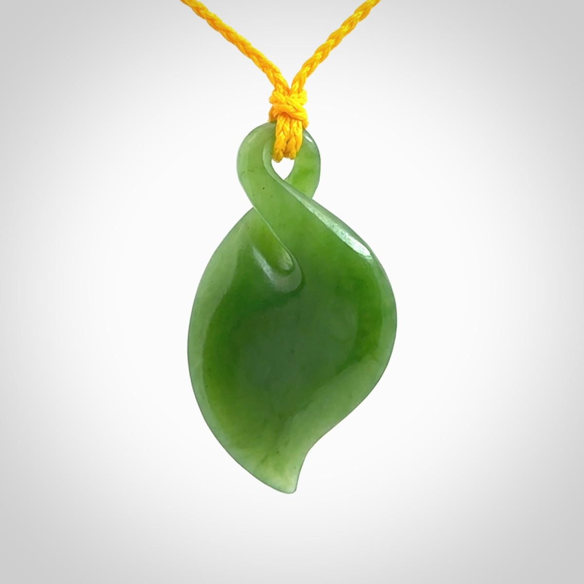 Hand carved New Zealand jade, single twist pendant with adjustable cord.