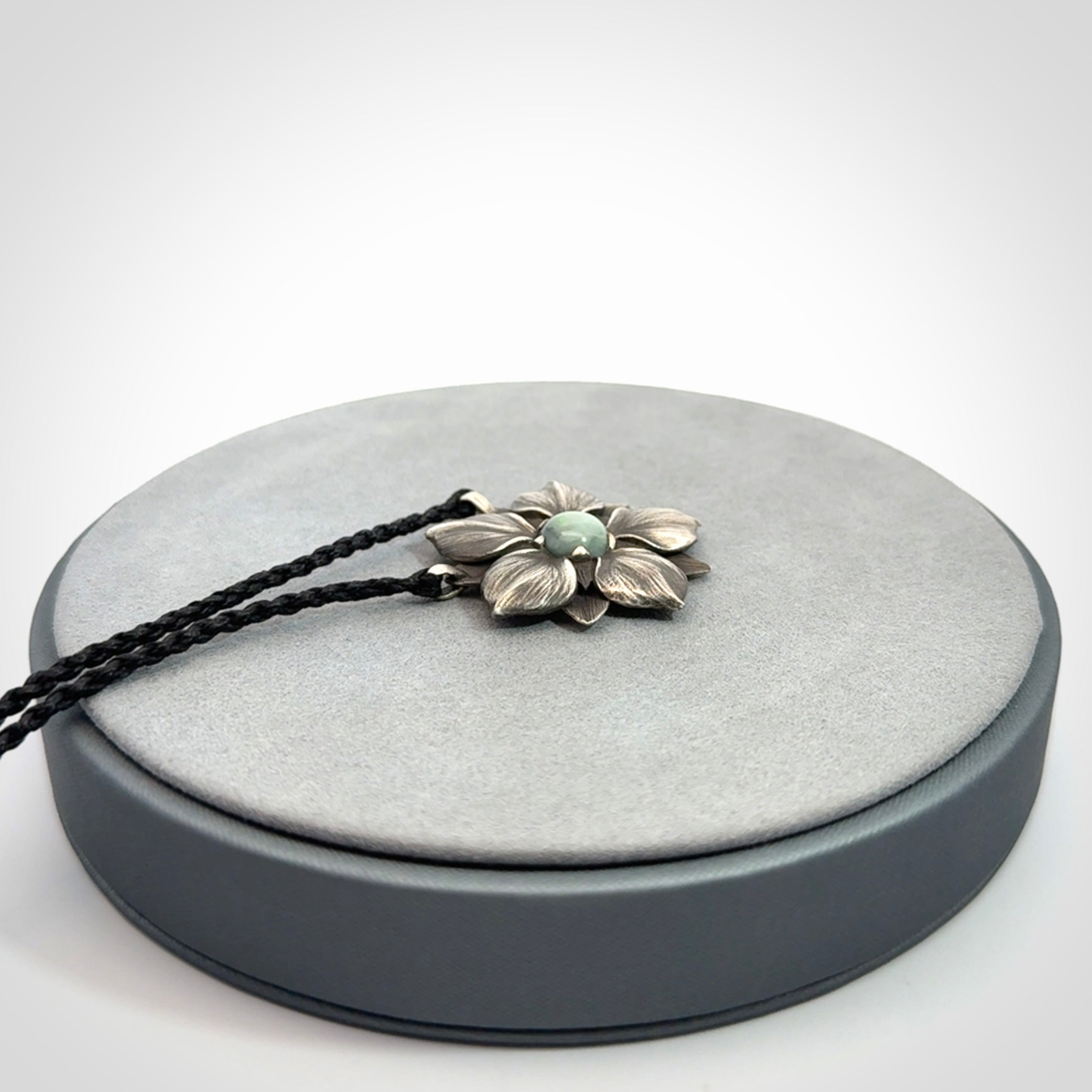 Hand crafted silver manuka flower pendant with jade insert