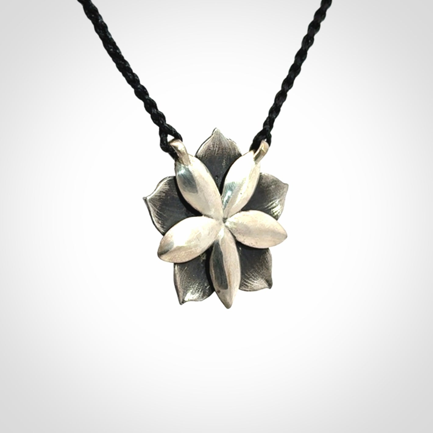 Hand crafted silver manuka flower pendant with jade insert