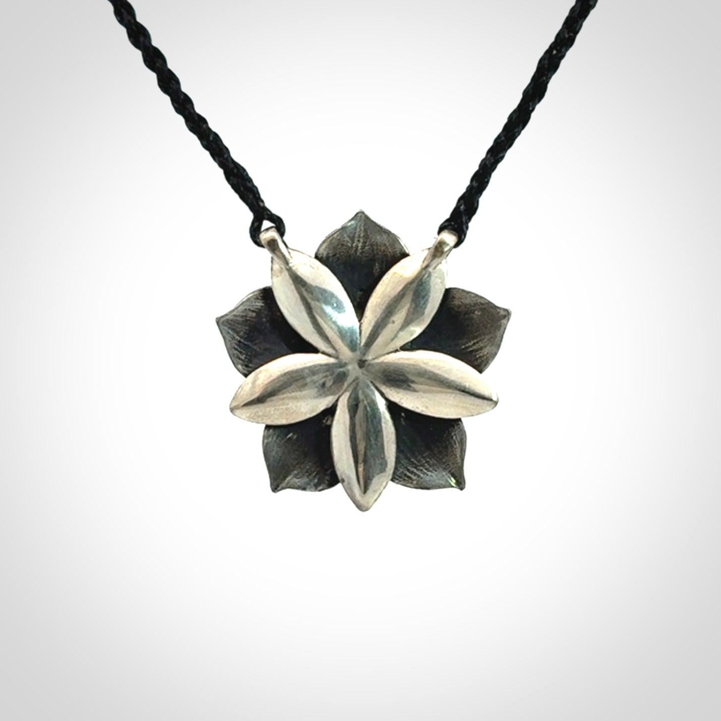 Hand crafted silver manuka flower pendant with jade insert