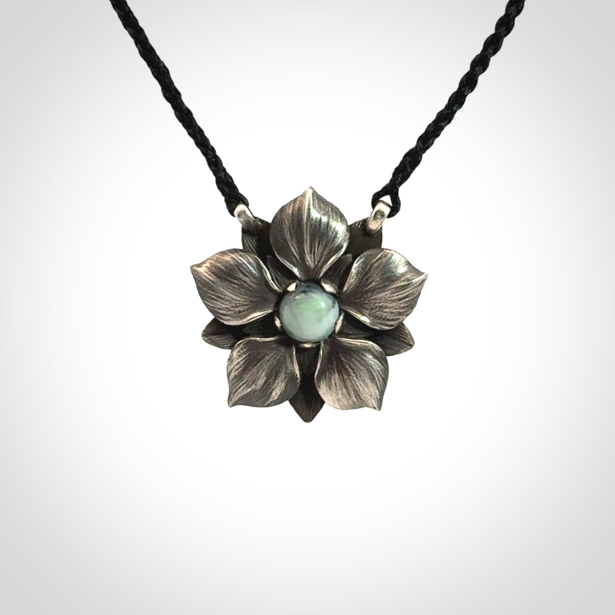 Hand crafted silver manuka flower pendant with jade insert