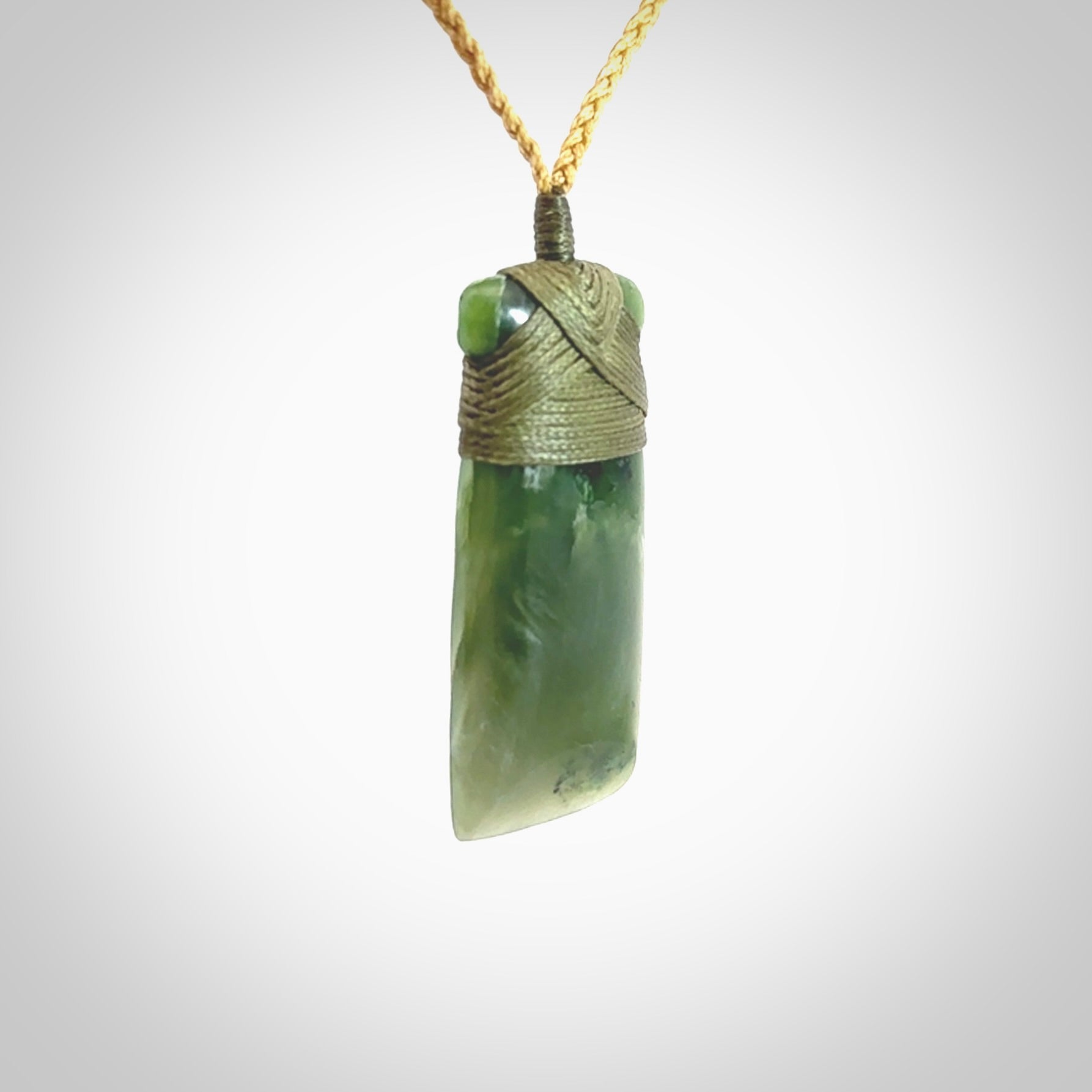 Hand carved jade toki pendant. Carved by NZ Pacific in green jade. Hand made Jade Toki necklace for men and women. Beautiful greenstone Toki with adjustable cord. Delivered to you with Express Courier.