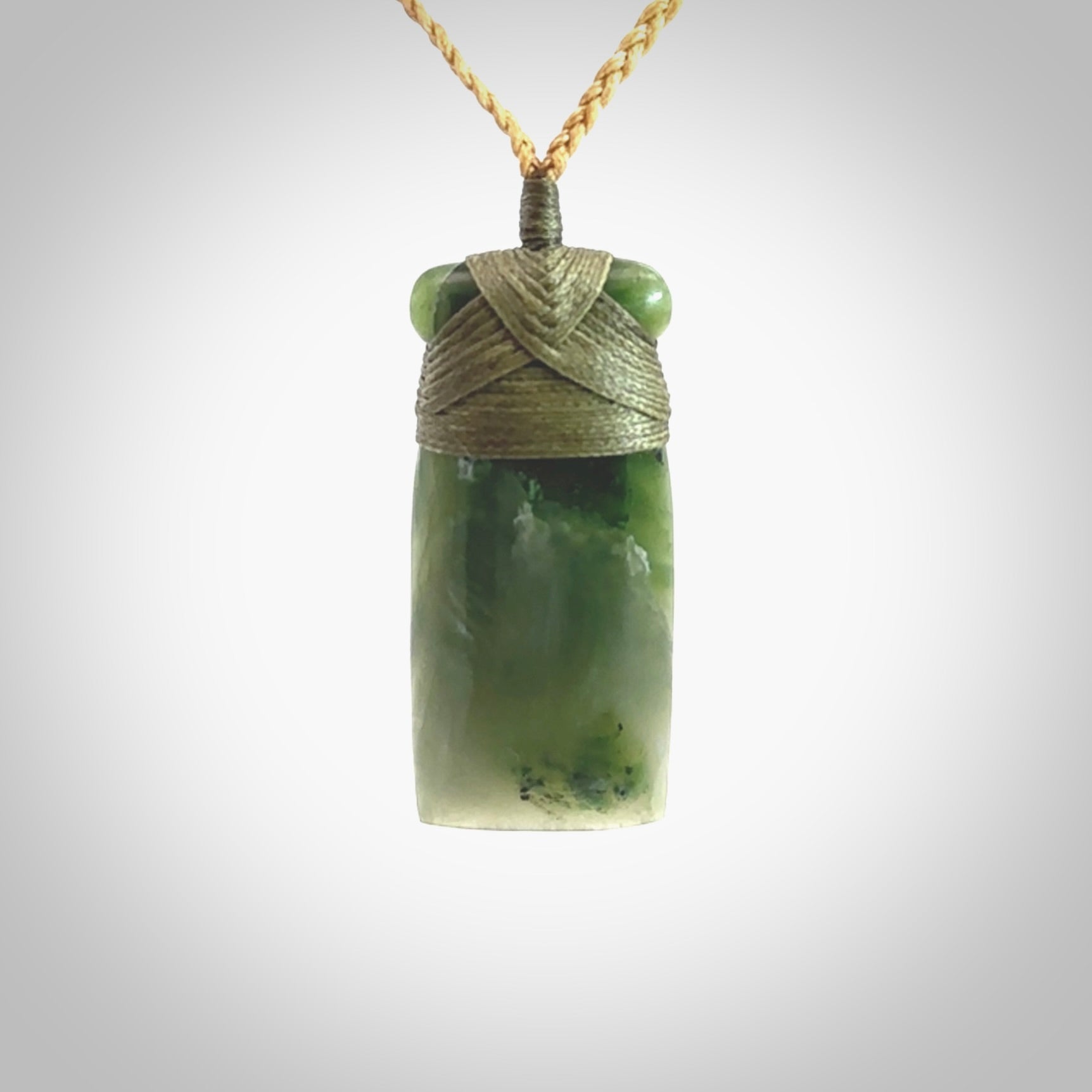 Hand carved jade toki pendant. Carved by NZ Pacific in green jade. Hand made Jade Toki necklace for men and women. Beautiful greenstone Toki with adjustable cord. Delivered to you with Express Courier.