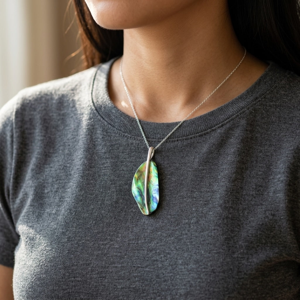 Woman wearing a paua shell and sterling silver pendant