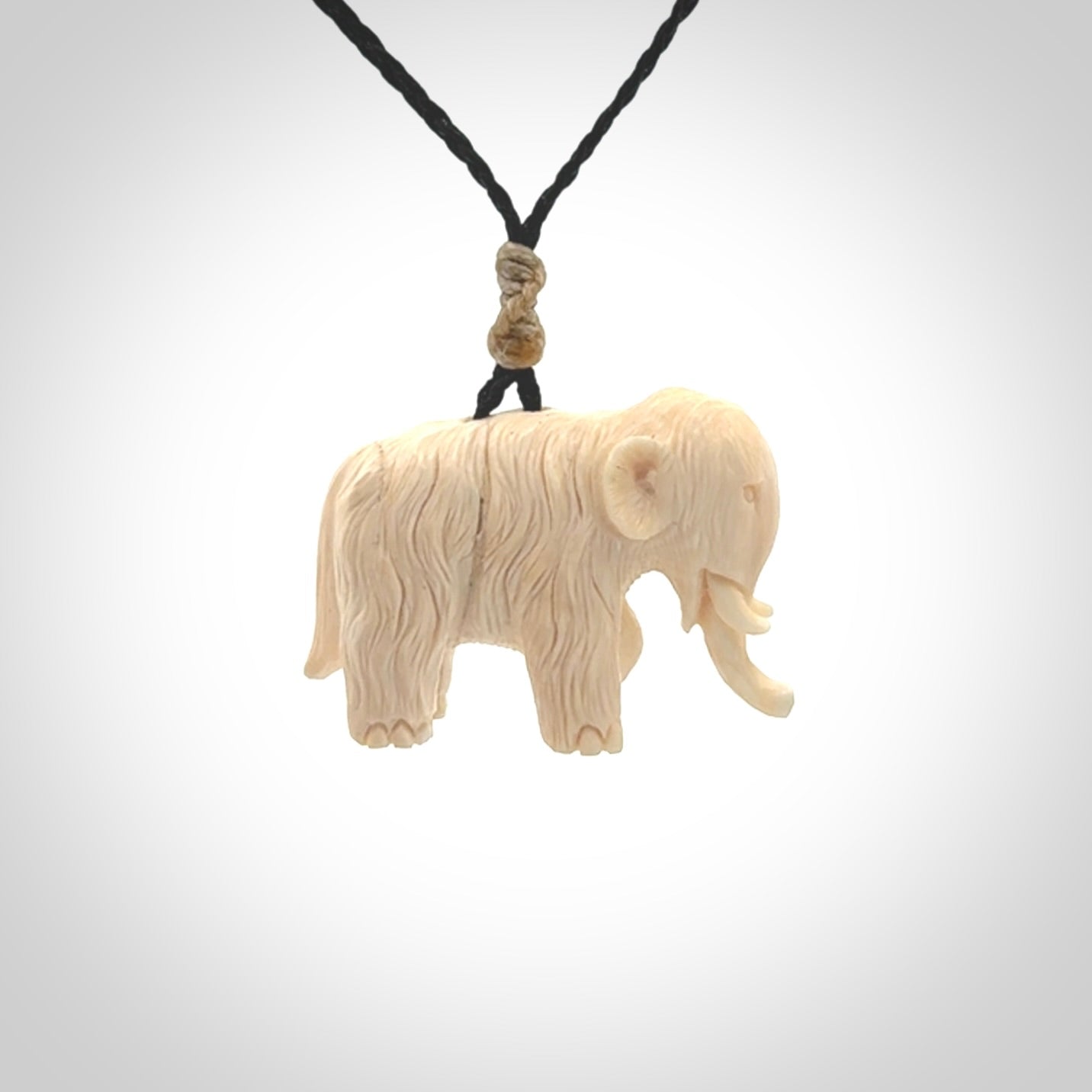 Hand carved woolly mammoth pendant. Carved from woolly mammoth tusk by NZ Pacific.
