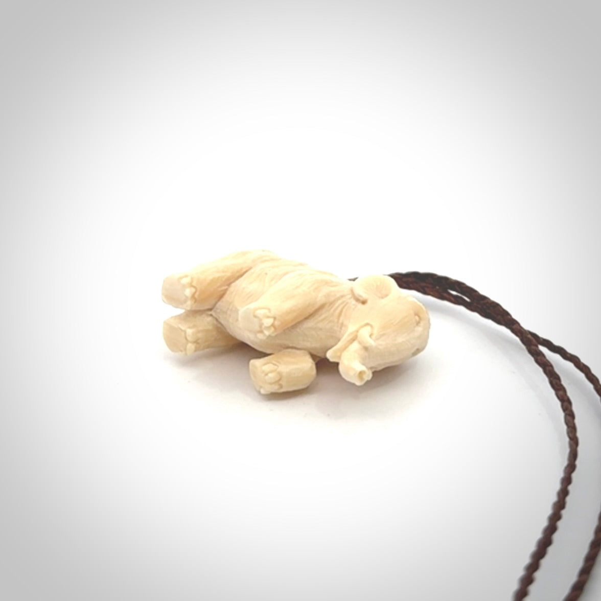 Hand carved woolly mammoth pendant. Carved from woolly mammoth tusk by NZ Pacific.