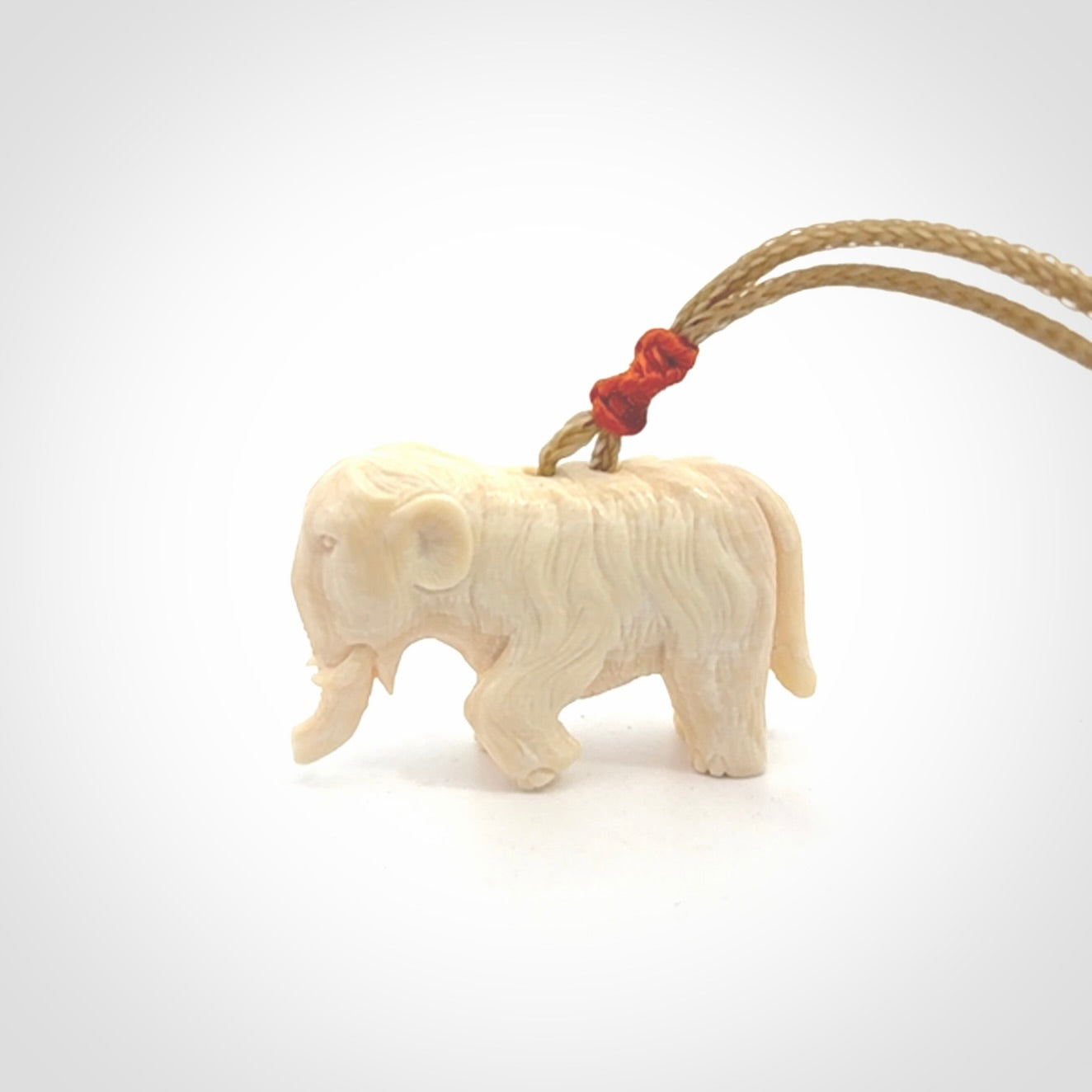 Hand carved woolly mammoth pendant. Carved from woolly mammoth tusk by NZ Pacific.