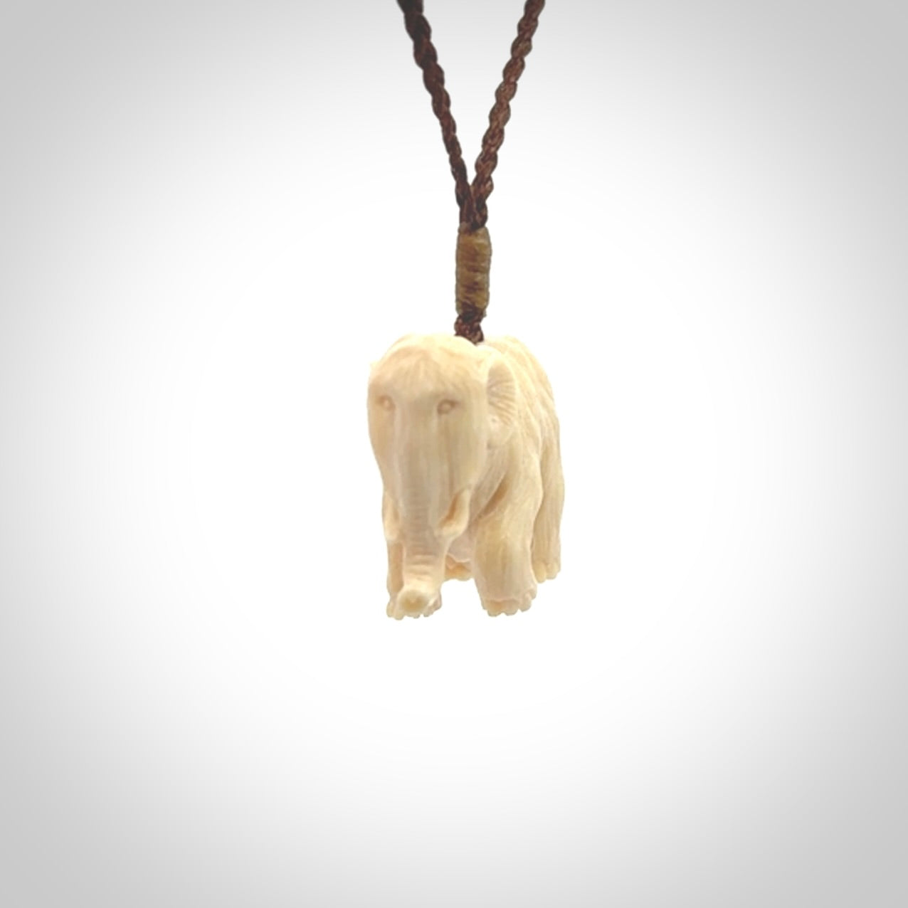 Hand carved woolly mammoth pendant. Carved from woolly mammoth tusk by NZ Pacific.