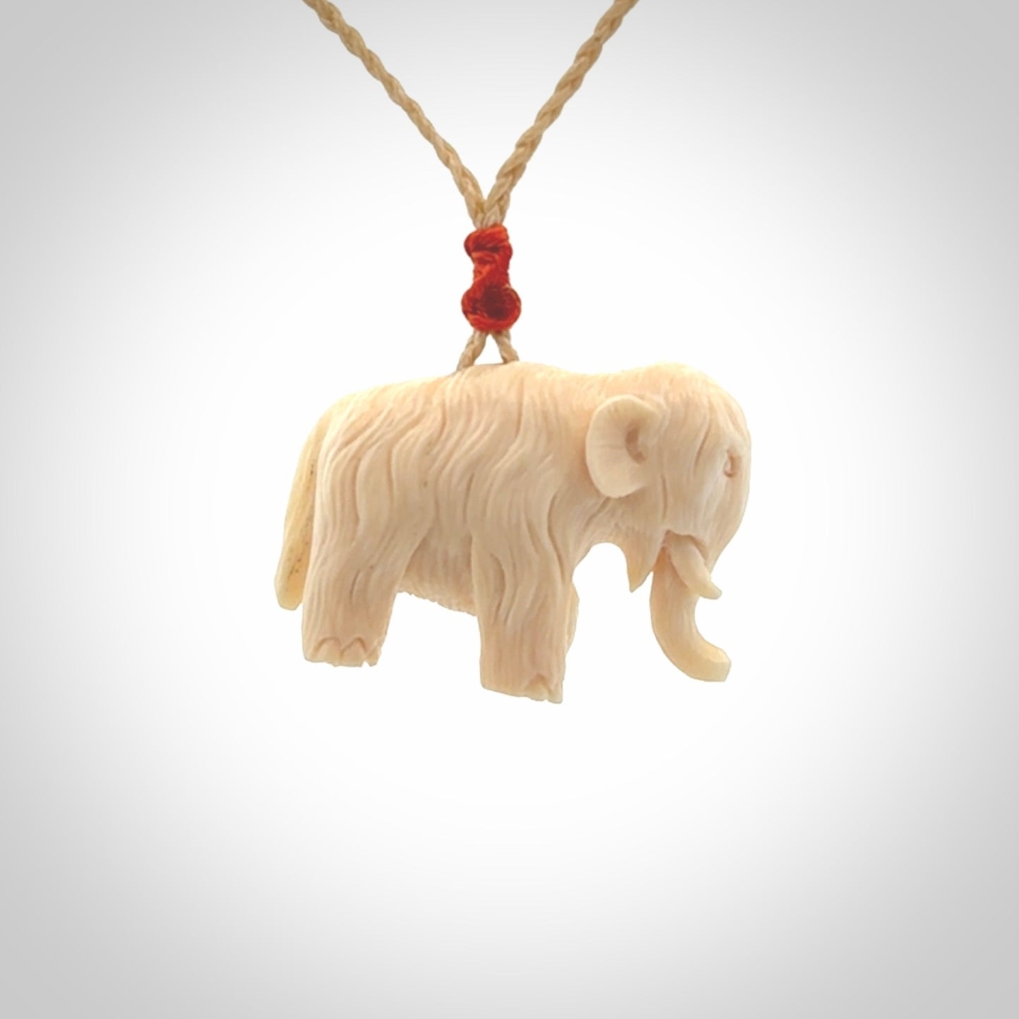 Hand carved woolly mammoth pendant. Carved from woolly mammoth tusk by NZ Pacific.