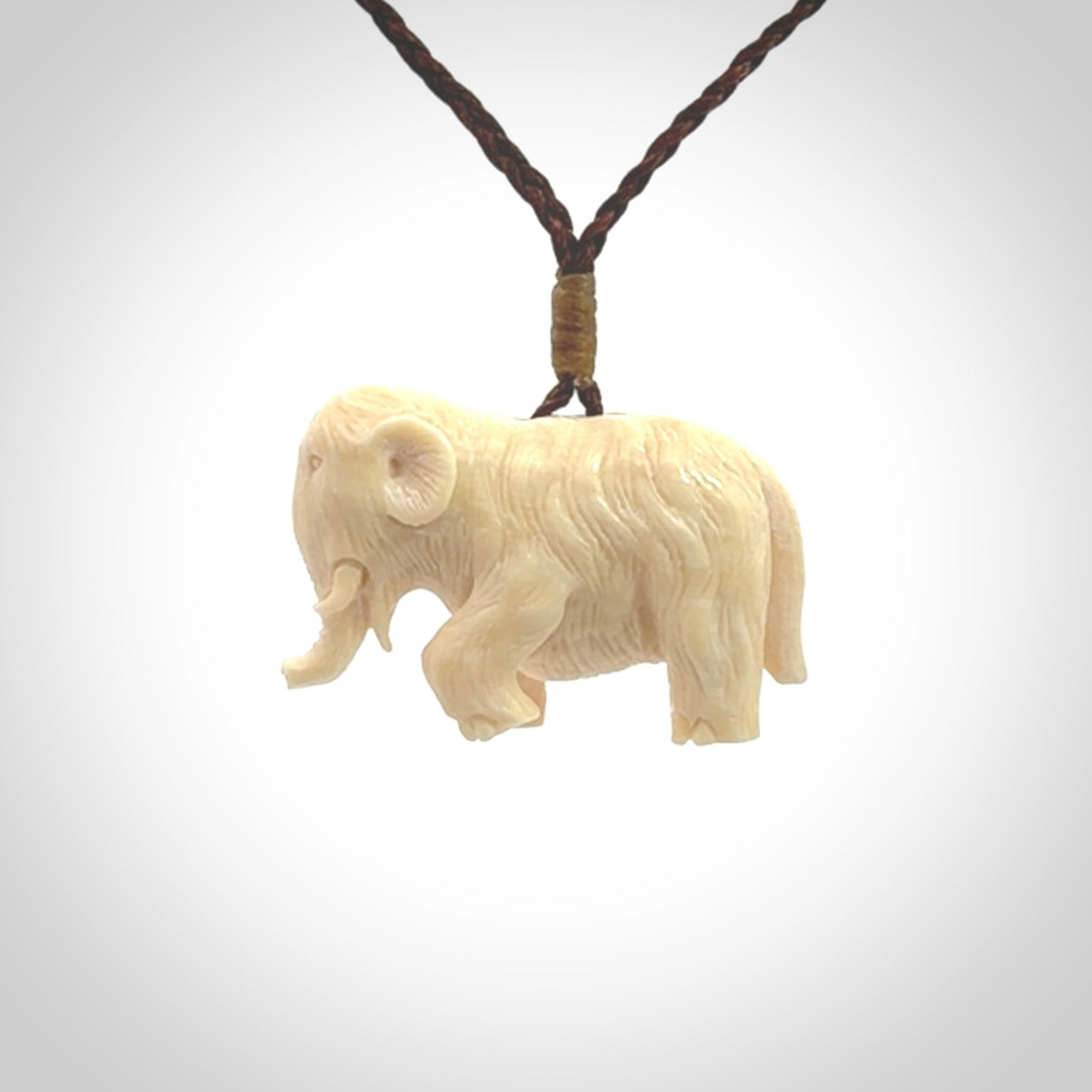 Hand carved woolly mammoth pendant. Carved from woolly mammoth tusk by NZ Pacific.