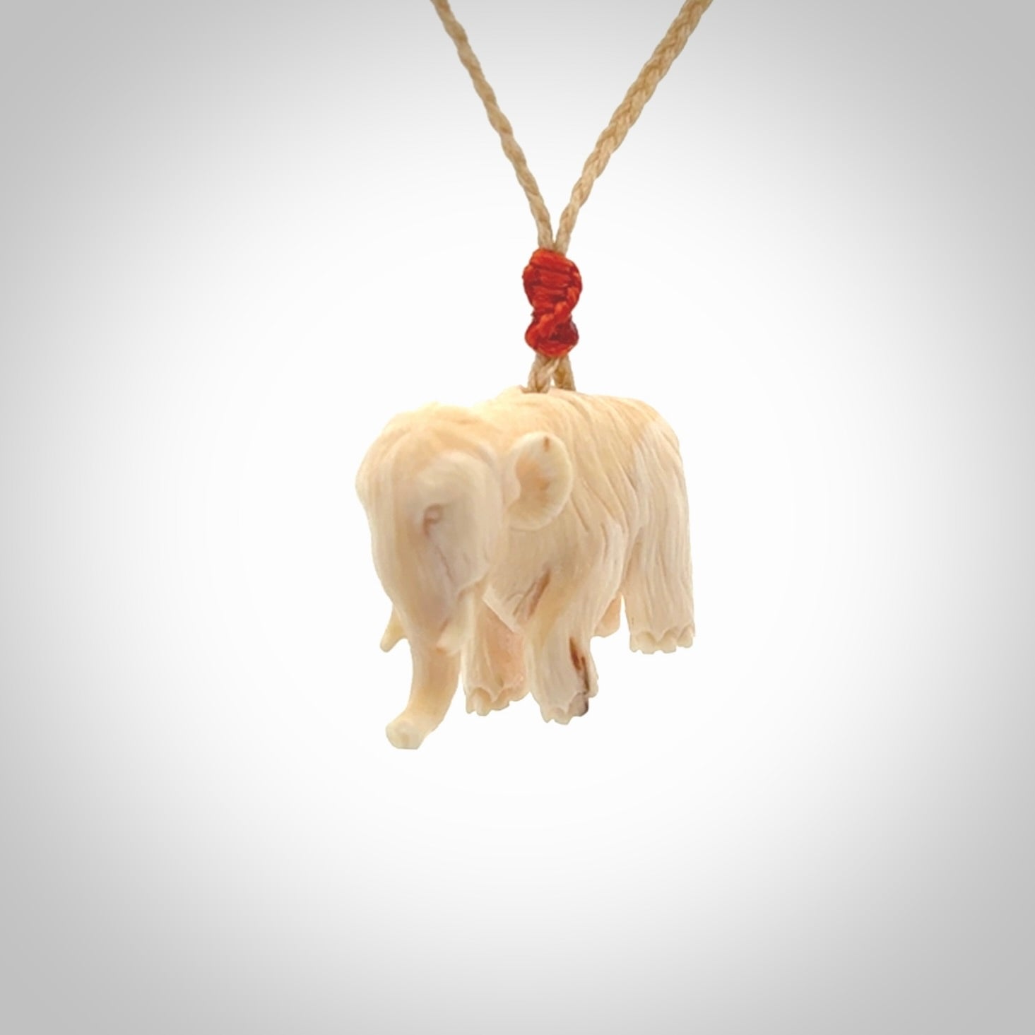 Hand carved woolly mammoth pendant. Carved from woolly mammoth tusk by NZ Pacific.