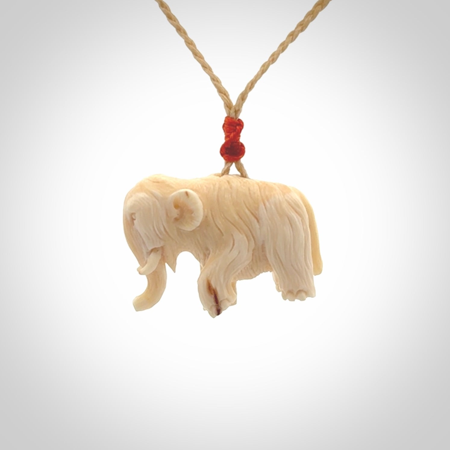 Hand carved woolly mammoth pendant. Carved from woolly mammoth tusk by NZ Pacific.