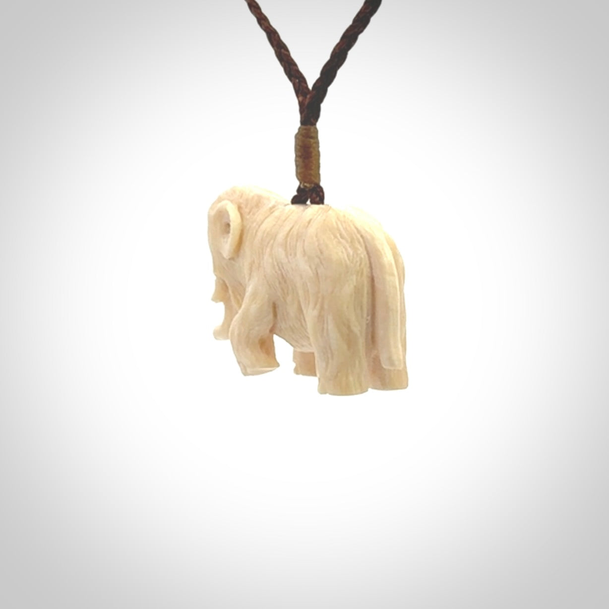 Hand carved woolly mammoth pendant. Carved from woolly mammoth tusk by NZ Pacific.