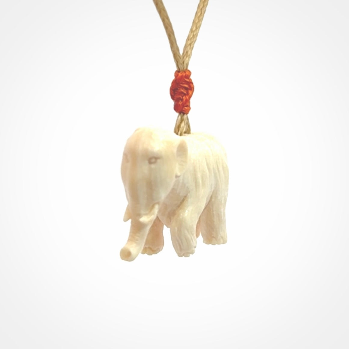 Hand carved woolly mammoth pendant. Carved from woolly mammoth tusk by NZ Pacific.