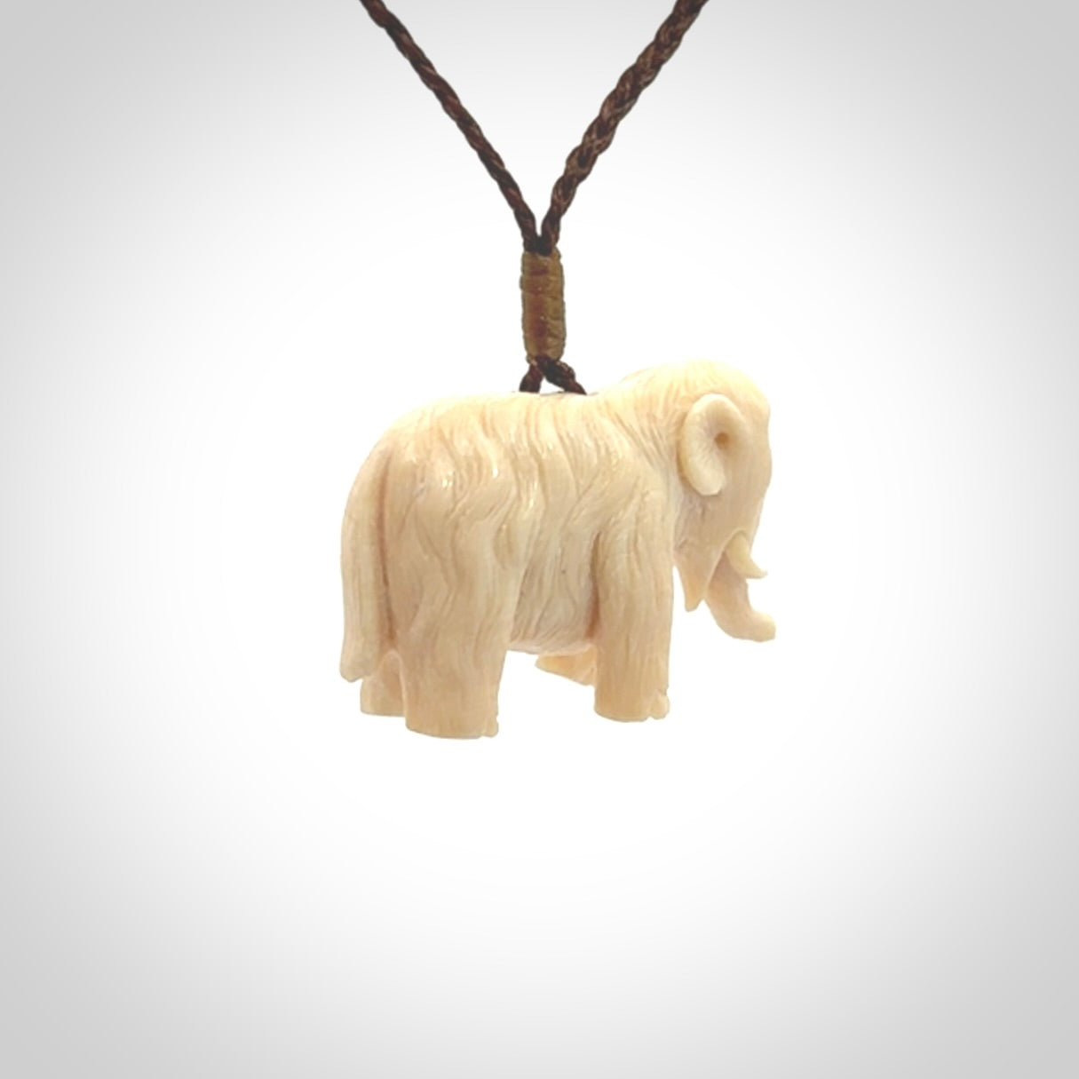 Hand carved woolly mammoth pendant. Carved from woolly mammoth tusk by NZ Pacific.