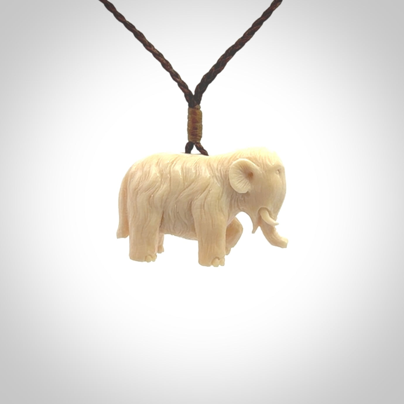 Hand carved woolly mammoth pendant. Carved from woolly mammoth tusk by NZ Pacific.