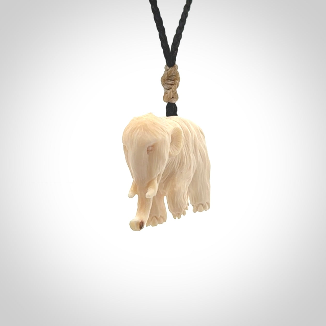 Hand carved woolly mammoth pendant. Carved from woolly mammoth tusk by NZ Pacific.