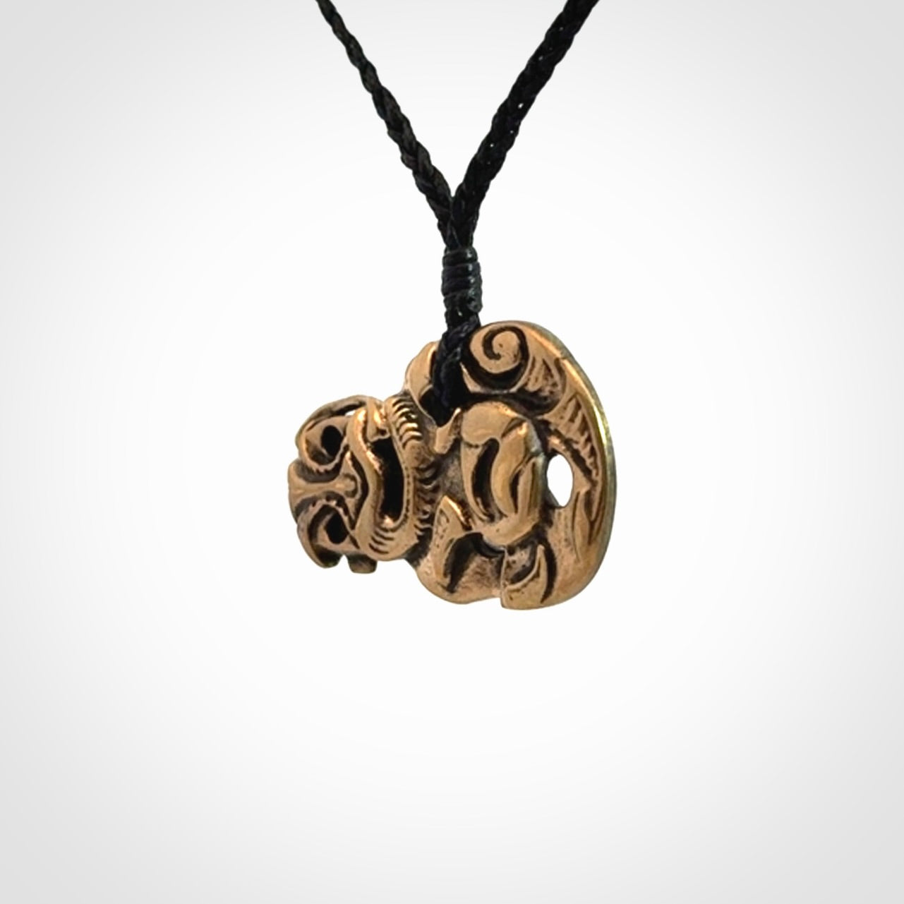 Bronze Tiki pendants