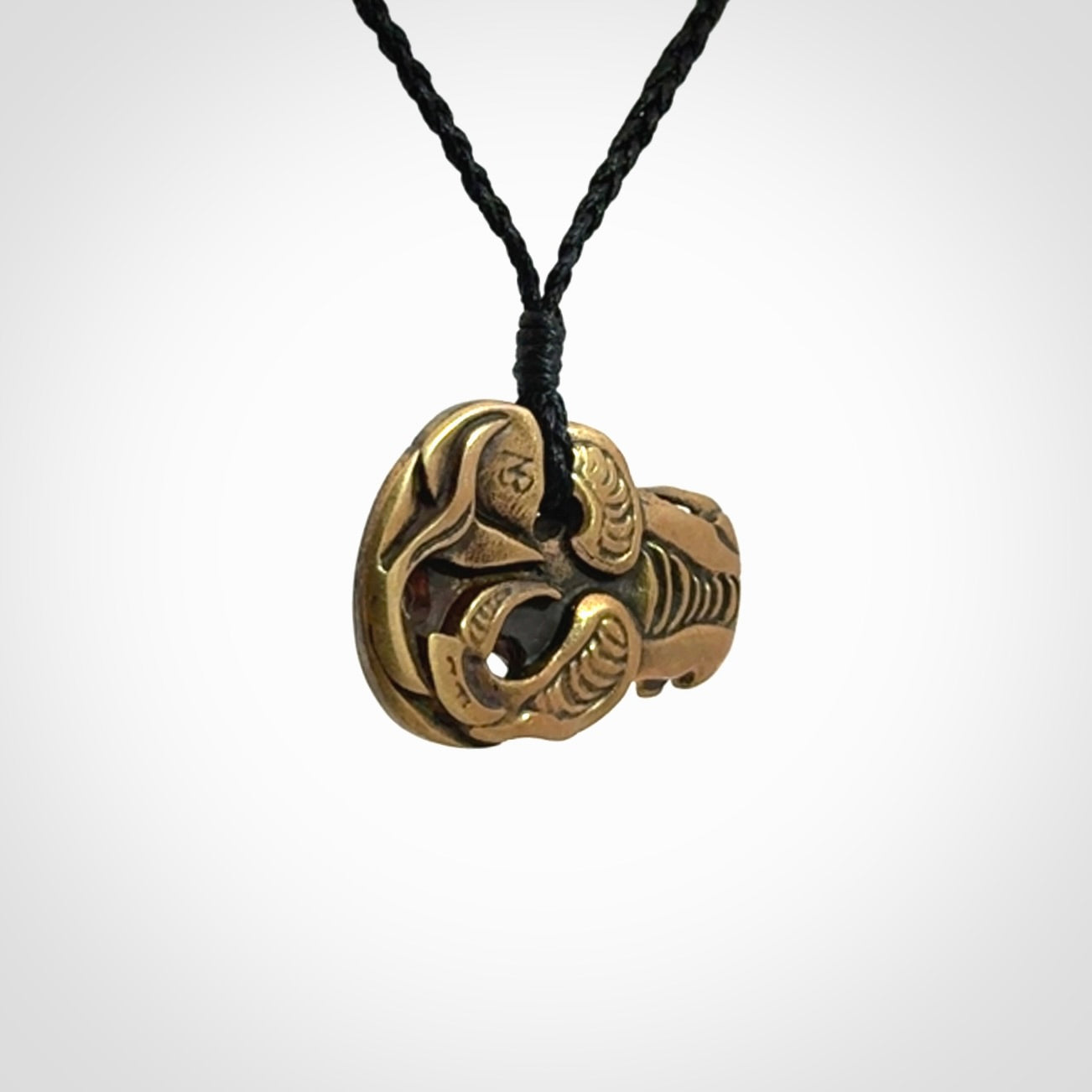 Bronze Tiki pendants