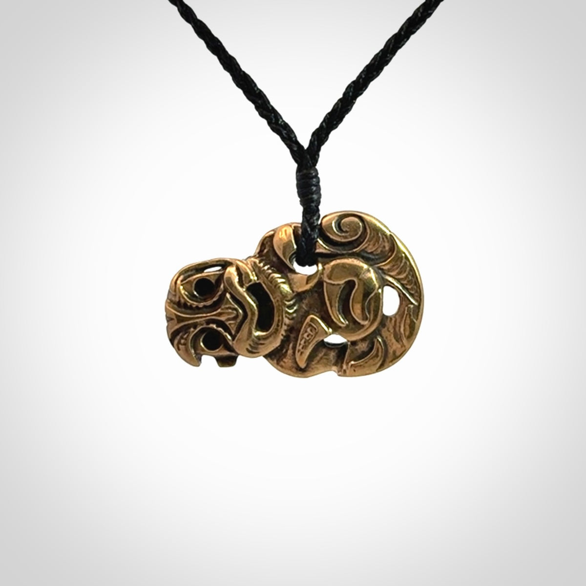 Bronze Tiki pendants