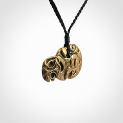 Bronze Tiki pendants