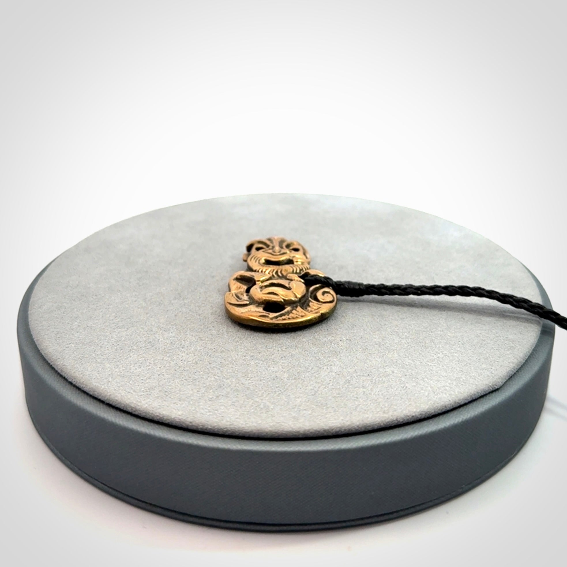 Bronze Tiki pendants