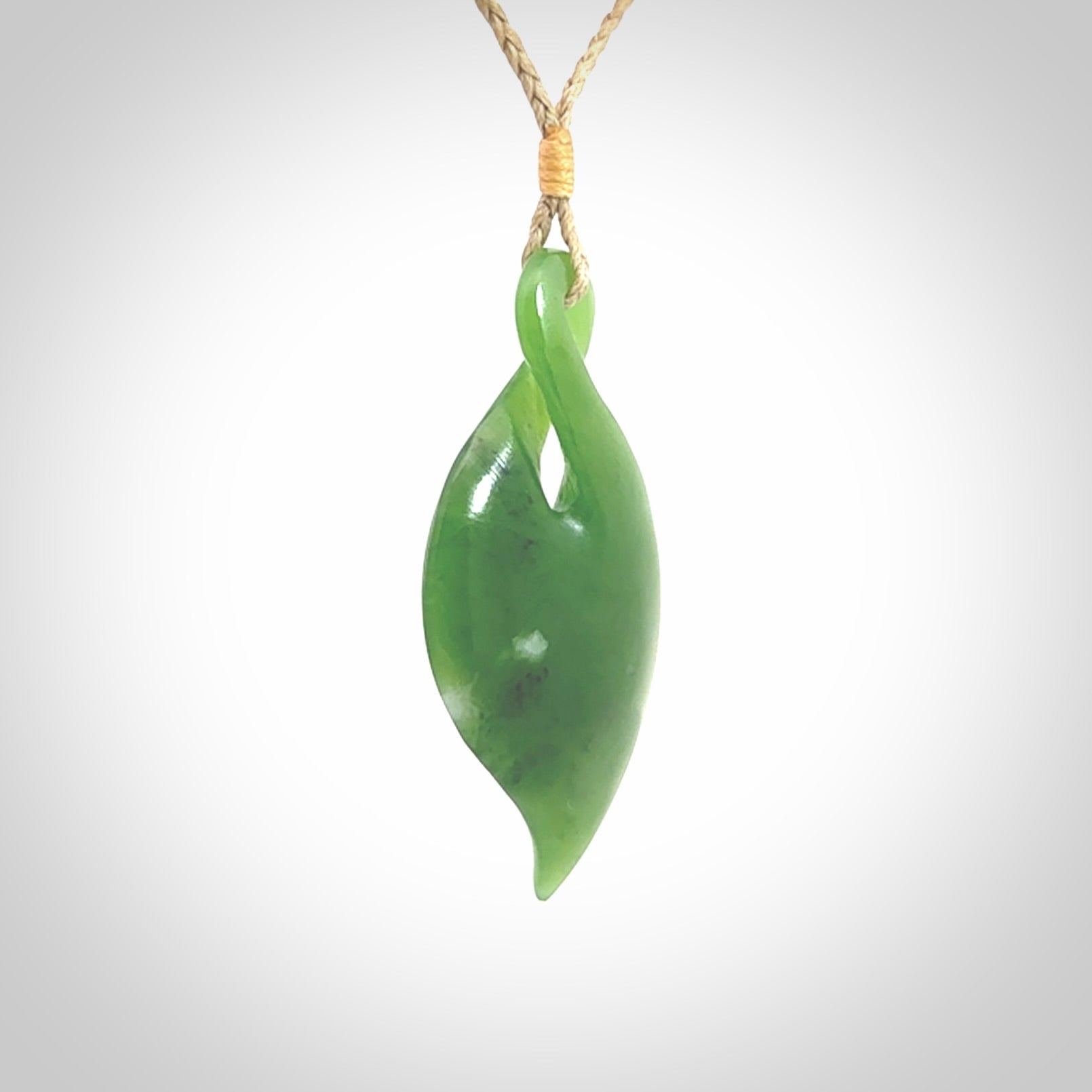 Hand carved New Zealand jade, single twist pendant. Jade twist pendant hand carved in New Zealand. Made by NZ Pacific, jade jewellery for sale online. One only hand made by Ross Crump.