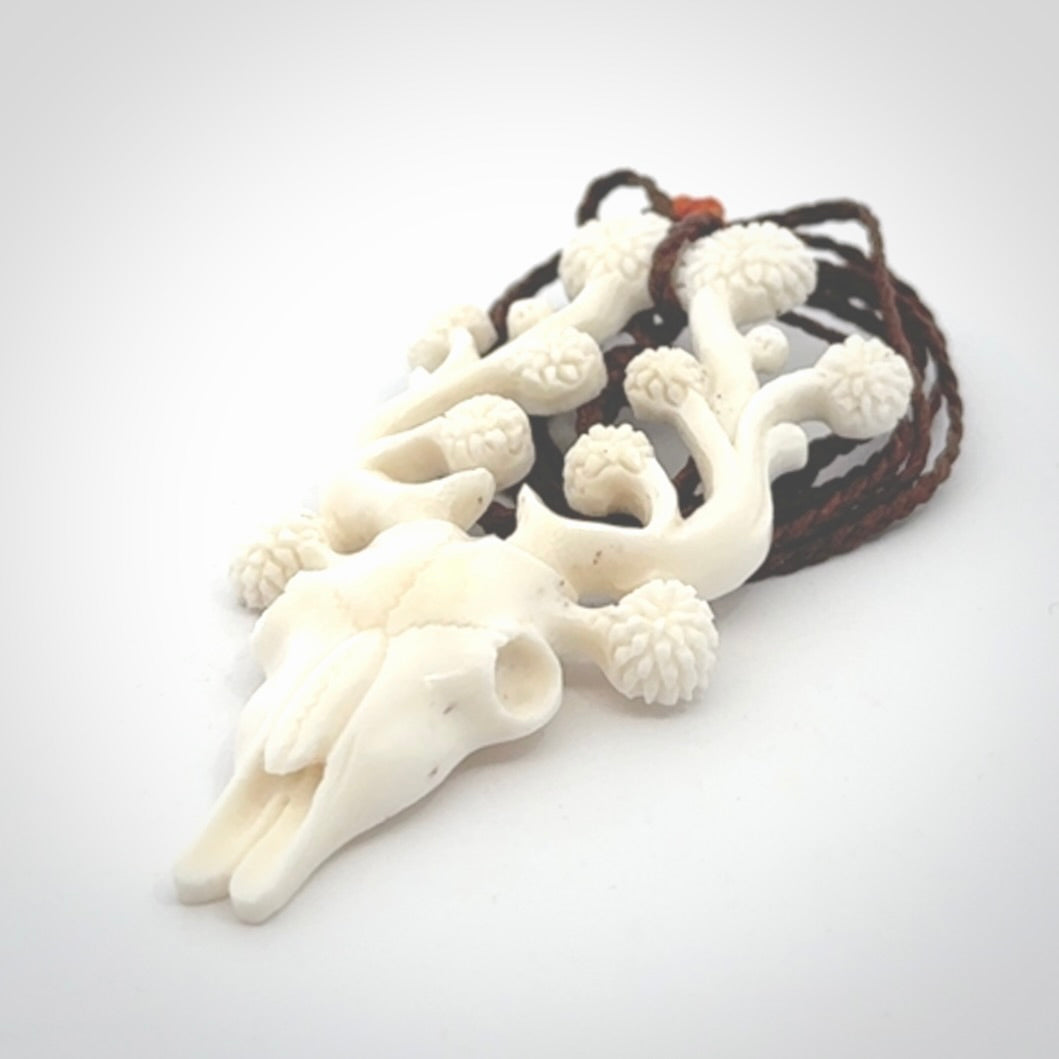 This is a hand carved contemporary bison bone skull pendant. This is a medium sized necklace and is a very unique pendant that is a piece for bison lovers.
