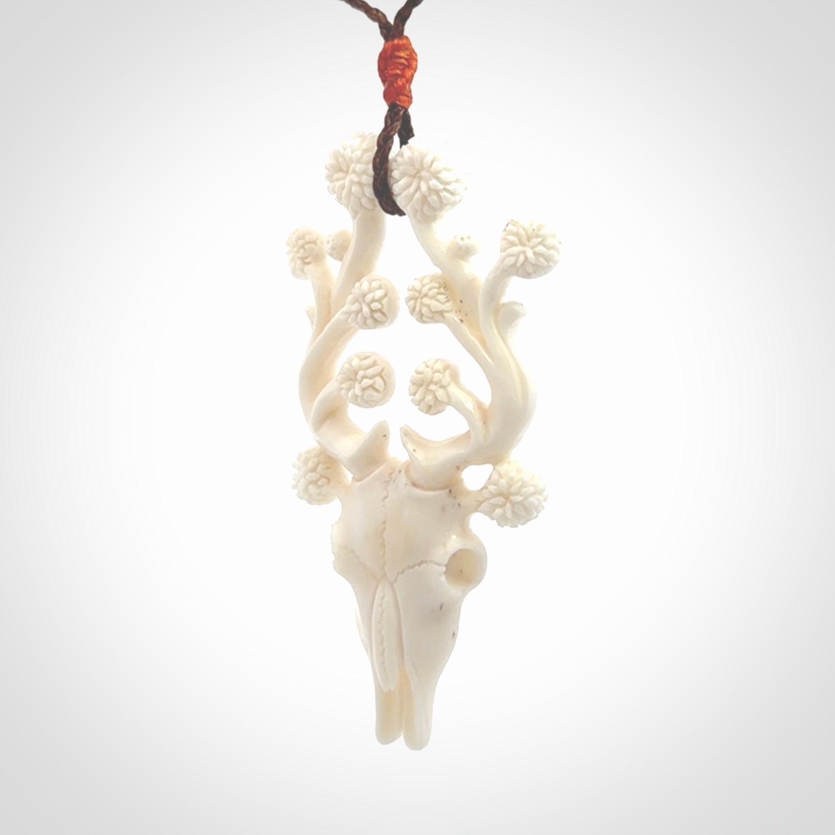 This is a hand carved contemporary bison bone skull pendant. This is a medium sized necklace and is a very unique pendant that is a piece for bison lovers.
