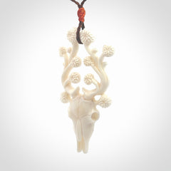 This is a hand carved contemporary bison bone skull pendant. This is a medium sized necklace and is a very unique pendant that is a piece for bison lovers.