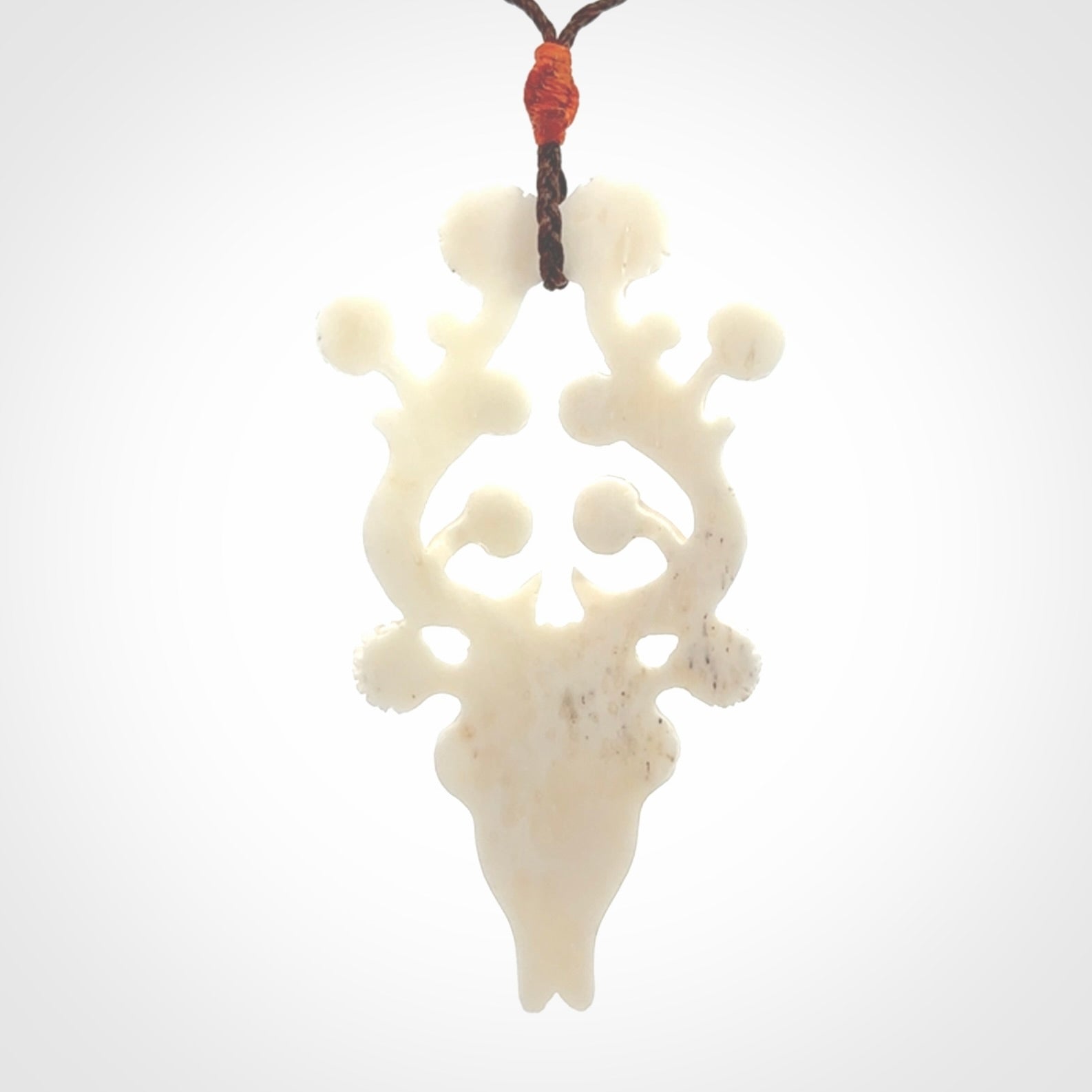 This is a hand carved contemporary bison bone skull pendant. This is a medium sized necklace and is a very unique pendant that is a piece for bison lovers.