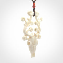 This is a hand carved contemporary bison bone skull pendant. This is a medium sized necklace and is a very unique pendant that is a piece for bison lovers.