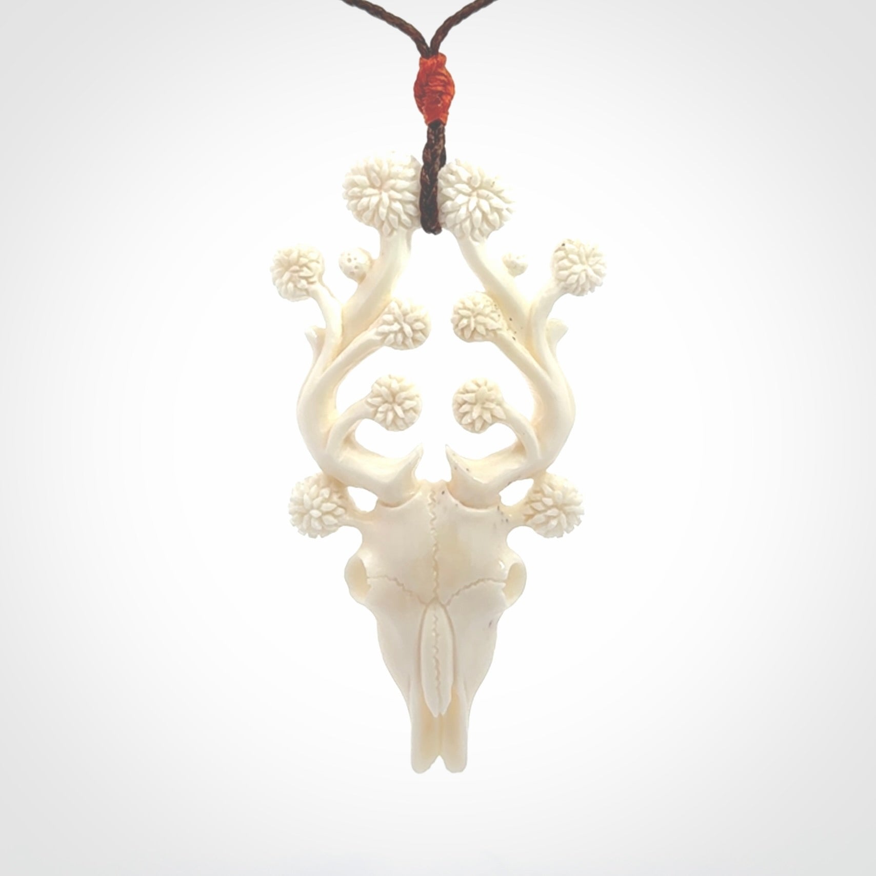 This is a hand carved contemporary bison bone skull pendant. This is a medium sized necklace and is a very unique pendant that is a piece for bison lovers.